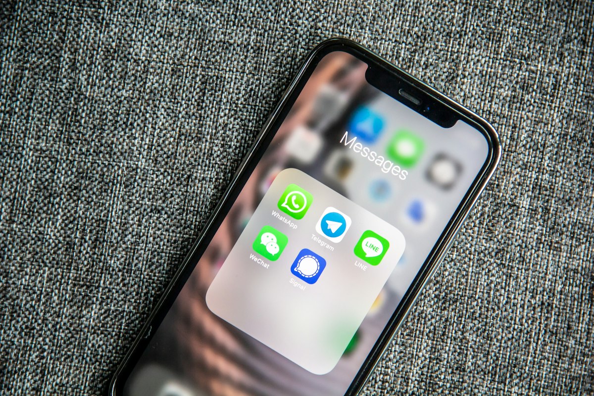 A smartphone screen displaying a WhatsApp chat conversation with notification icons