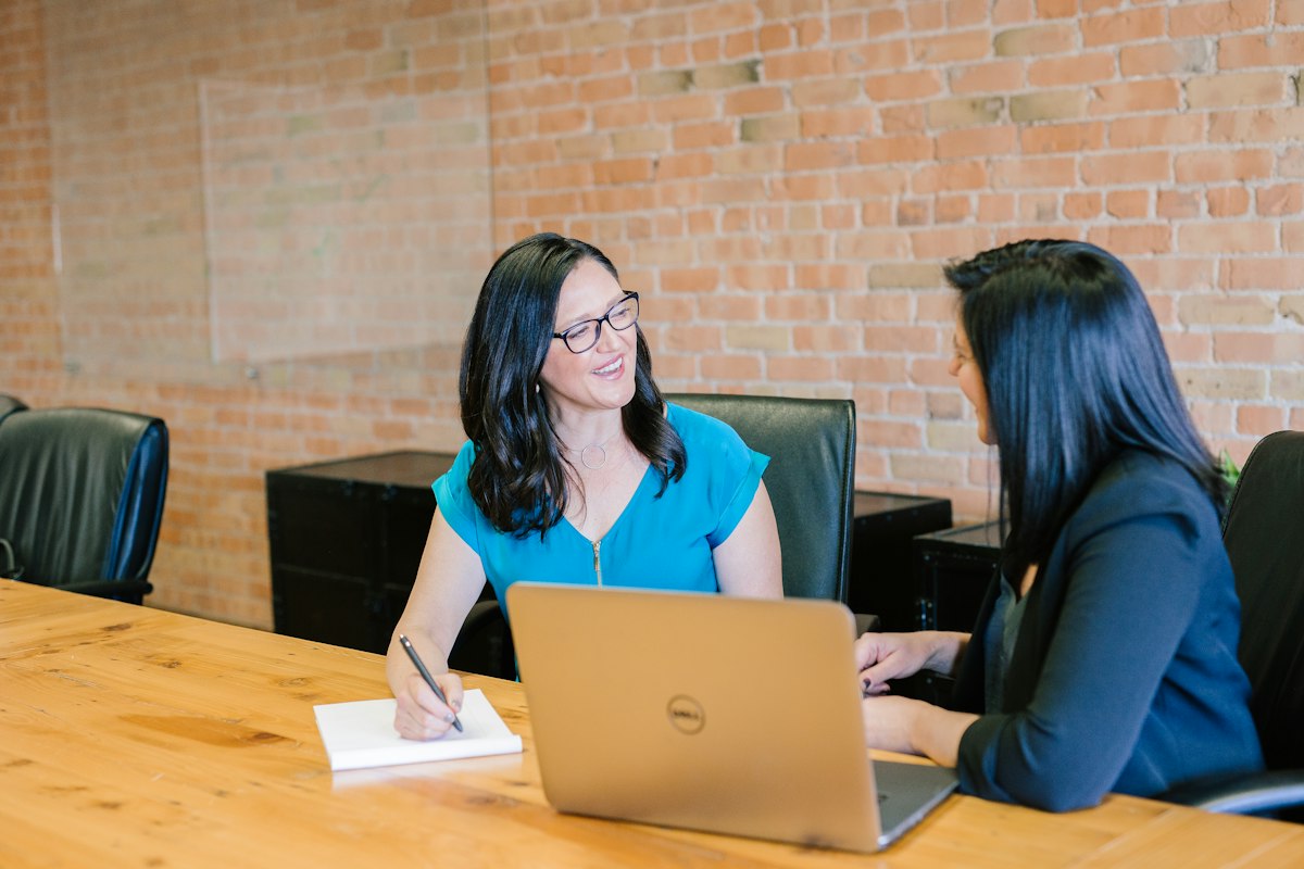 Landlord reviewing tenant documents and a lease agreement at a desk