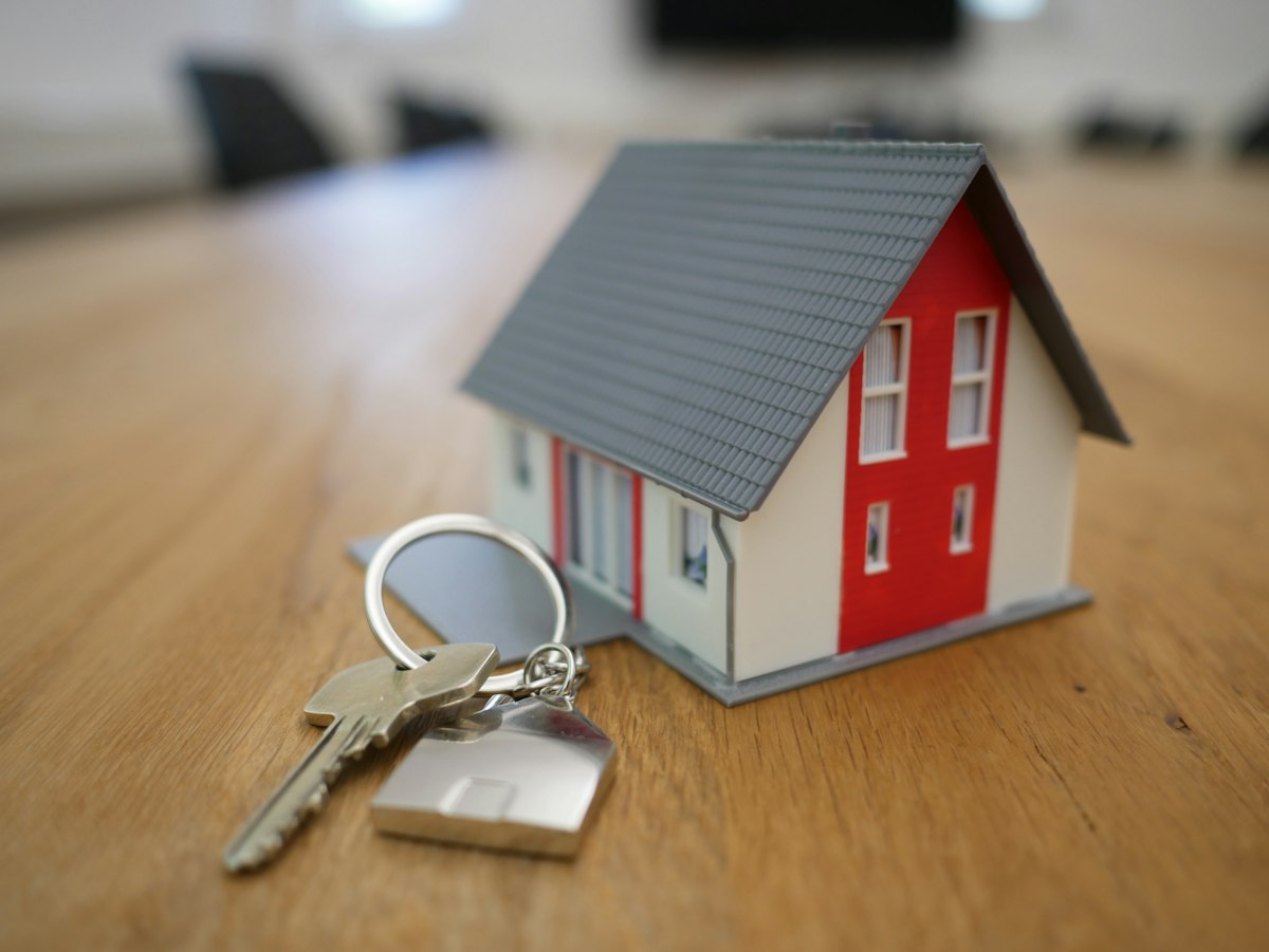 Property manager handing over keys to a new tenant